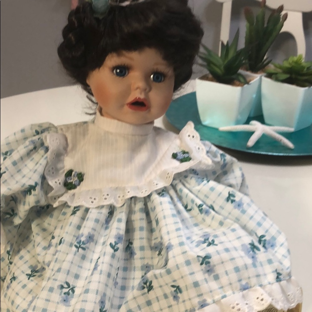 Poutin baby blue eyed porcelain doll